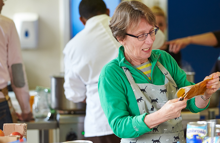 Volunteers prepare food at a Food Works bistro night