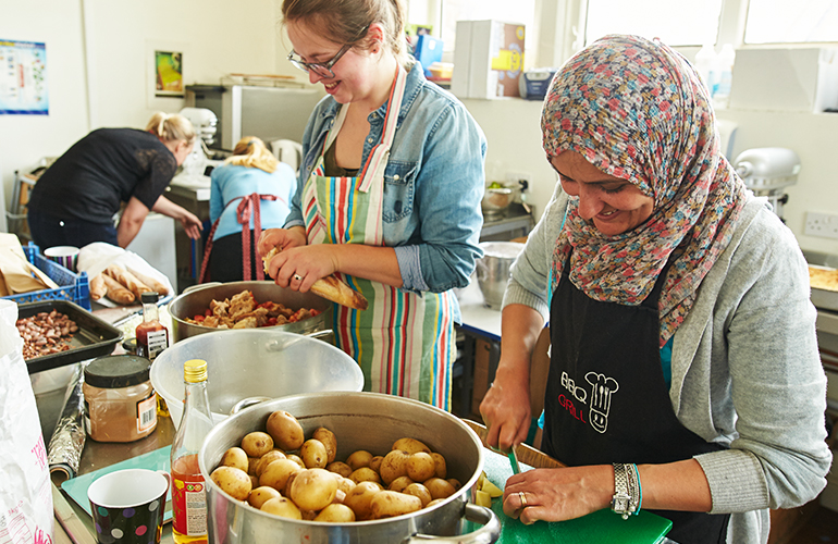 Volunteers prepare food at a Food Works bistro night